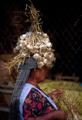 Woman carrying garlic